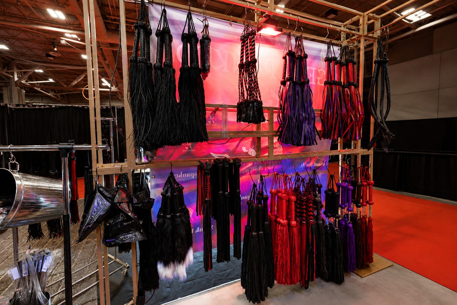 Person-free display of floggers at a Spank Daddy trade show booth